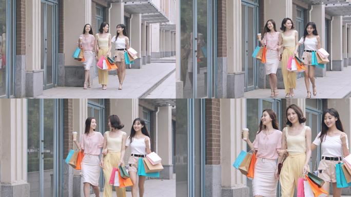 三个年轻女孩在逛街购物