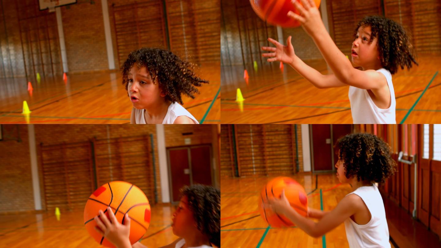 运动的非洲裔美国女学生在篮球场上玩篮球在学校4k
