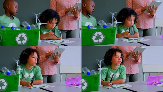 小学生在课桌上学习绿色能源和循环利用