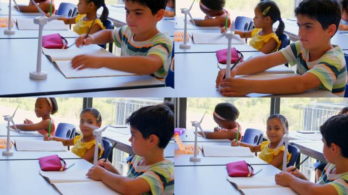 学校里，孩子们在教室书桌前学习