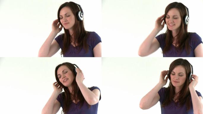 女人用耳机听音乐特写
