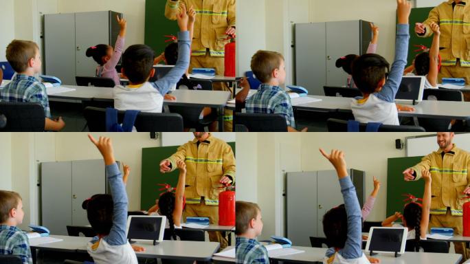 学生举起手，而男性消防员在教室里教消防安全4k