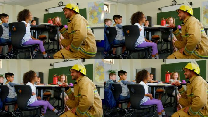 年轻英俊的白人男性消防员教女学生消防安全在教室4k