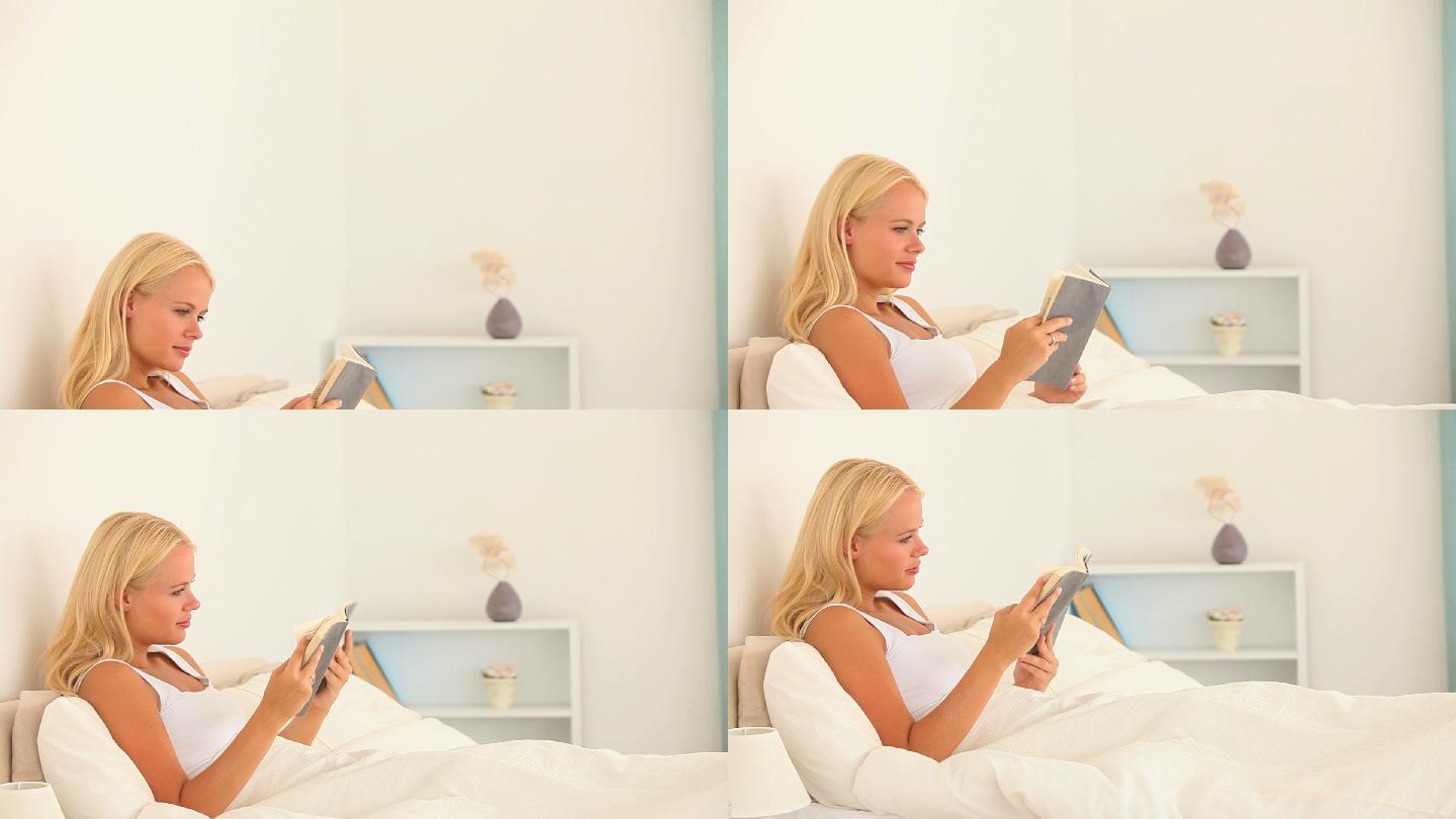 一个女人在卧室里看书特写