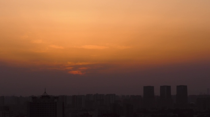 城市暮色夕阳西斜夕阳红落日晚霞暮色苍茫