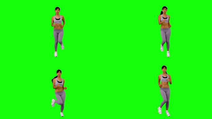 绿色屏幕下女人穿着运动服跑步锻炼特写