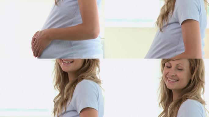 一个孕妇在测量她的腰围特写