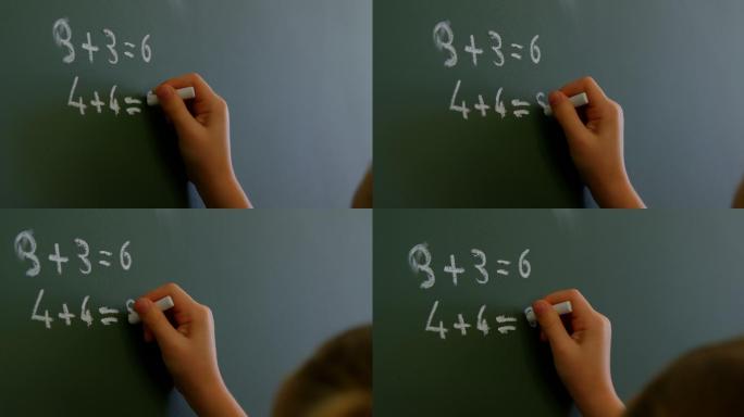 女学生在教室里用粉笔在黑板上写4k