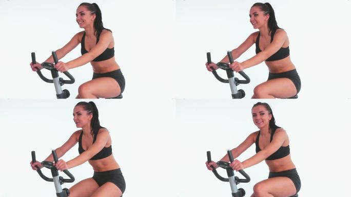 女人在骑动感单车锻炼特写