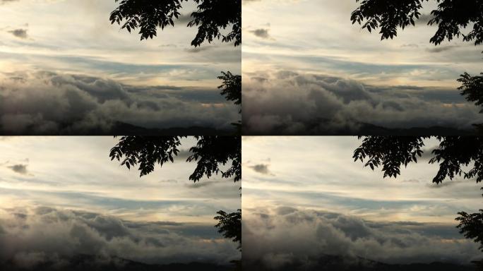 高处云层延时摄影高处云层云层山峦夕阳落日