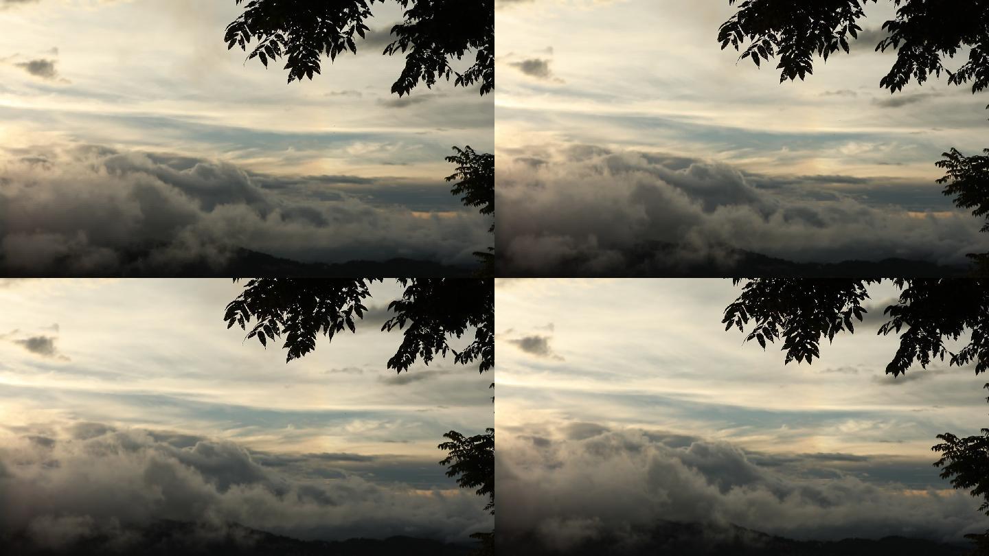 高处云层延时摄影高处云层云层山峦夕阳落日