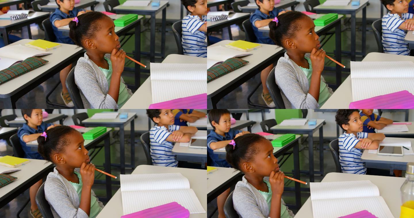 多民族学校的孩子在课桌上学习