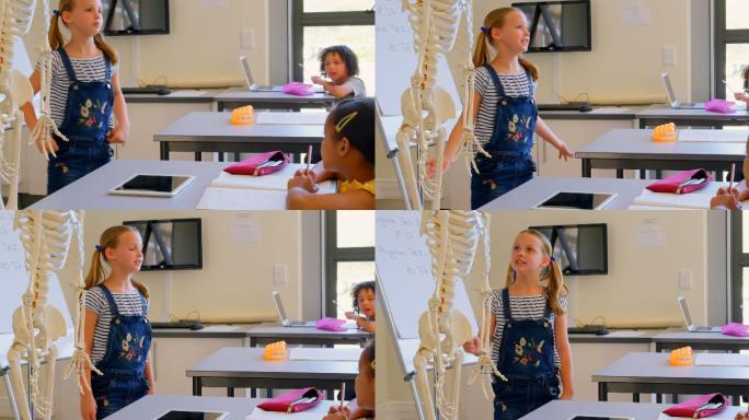女学生在4k教室里讲解人体骨骼模型