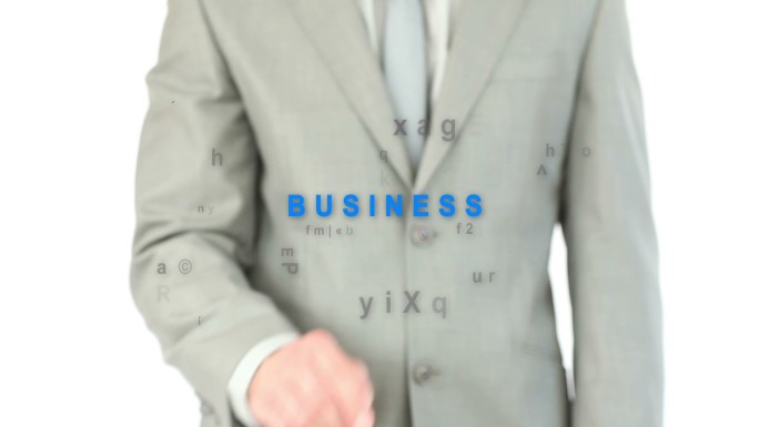 男人在白色背景下触摸“business”这个词