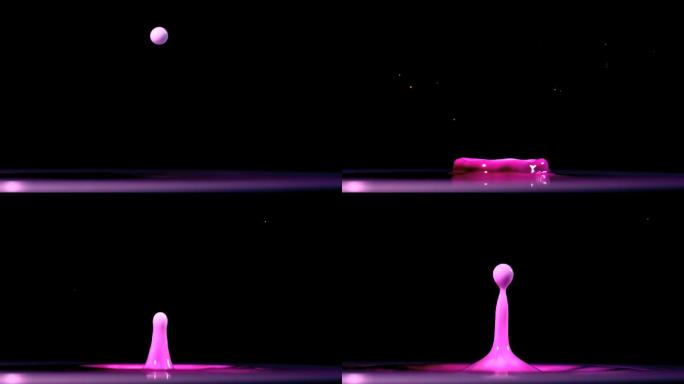 一滴水滴在紫色的颜料上特写