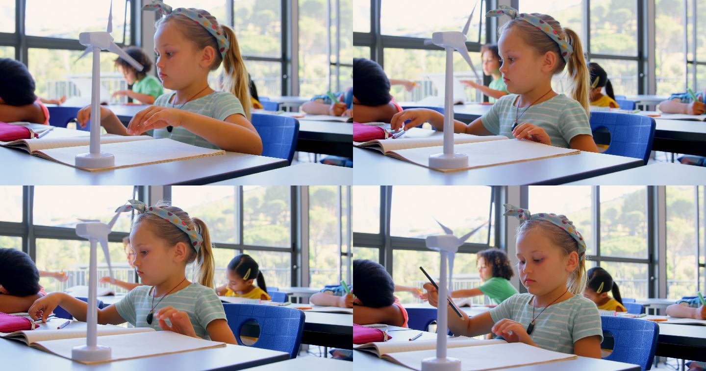 白人女学生在书桌前学习，在4k教室