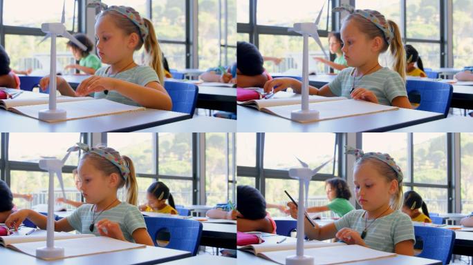 白人女学生在书桌前学习，在4k教室