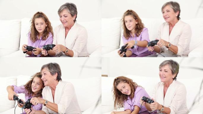 祖母和孙女在沙发上打游戏特写