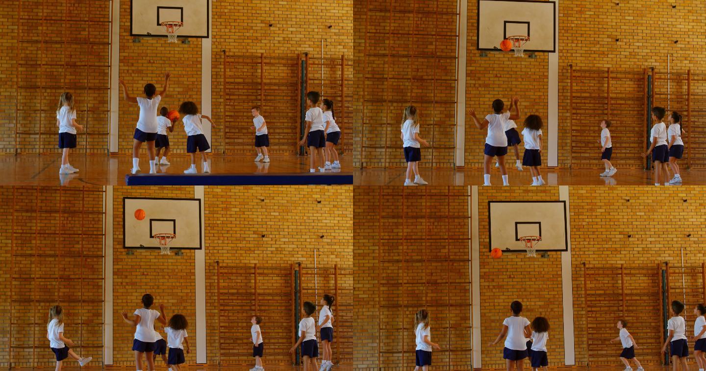 学校里的孩子们在篮球场上练习篮球