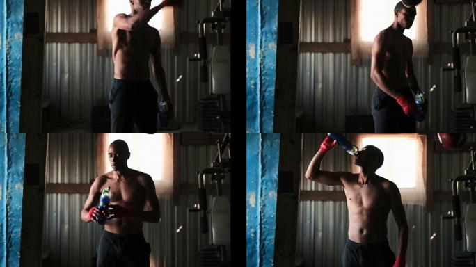非裔美国男拳击手在健身室浸泡水4k