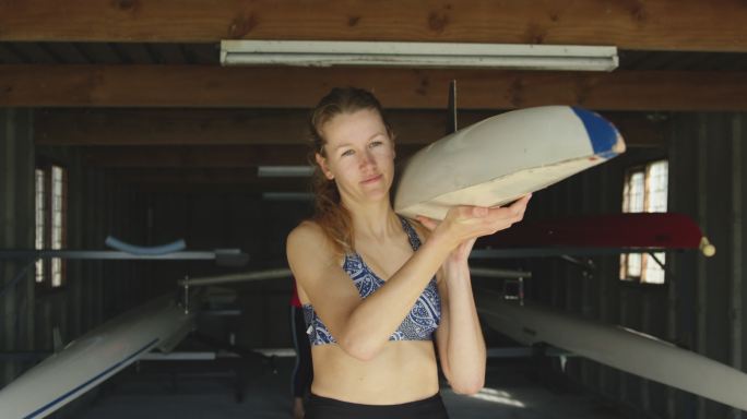 Female rowing team training on a river