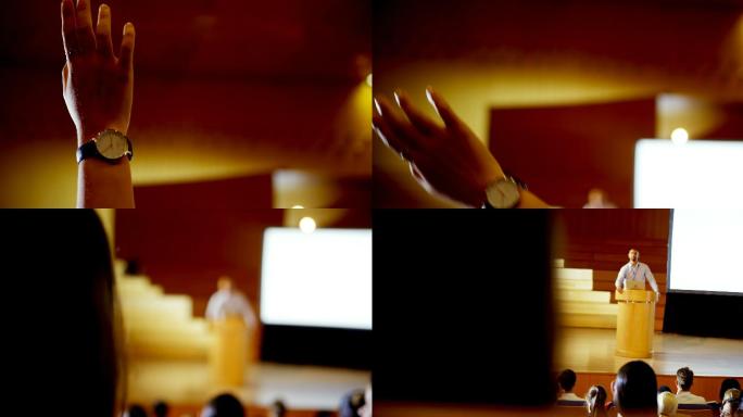 在4k大礼堂举行的商业研讨会上举手的女商人