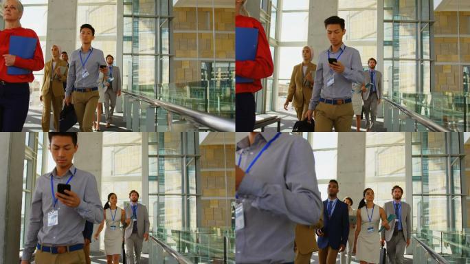 Business people walking in office building 4k