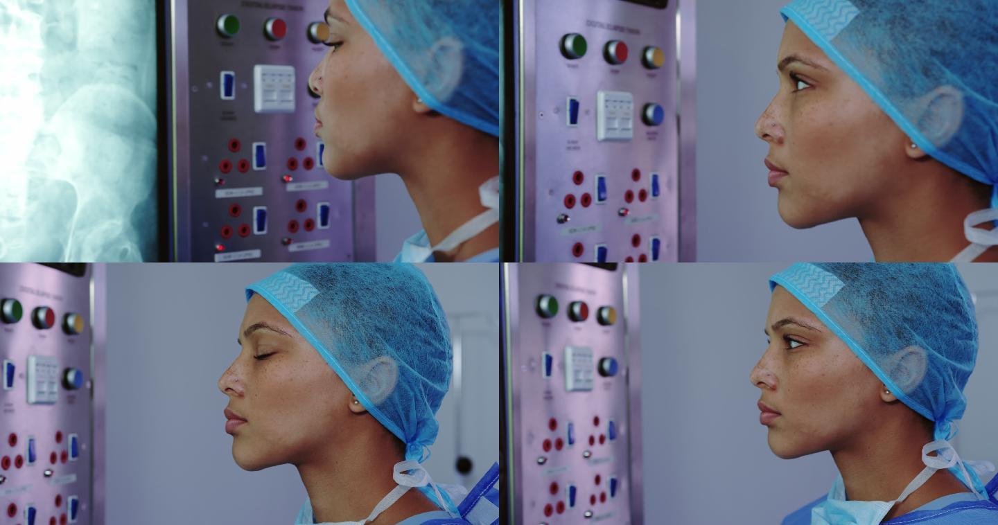 特写的非洲裔美国女医生看x光报告灯箱在医院