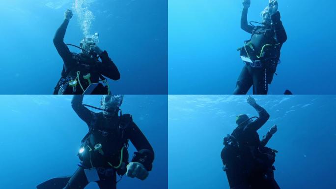 水肺潜水员在海里潜水练习