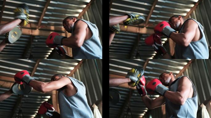 非裔美国男拳击手练习拳击与教练在健身房4k