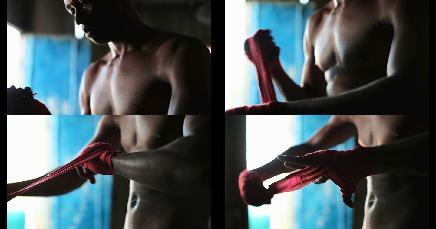 非裔美国男性拳击手戴手包在健身工作室4k