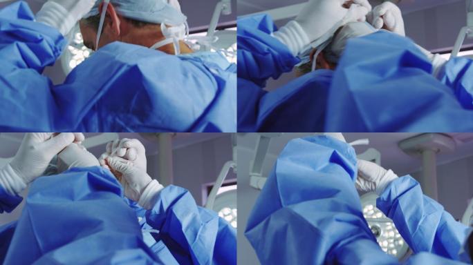 女医生在手术室帮助男医生戴口罩的特写