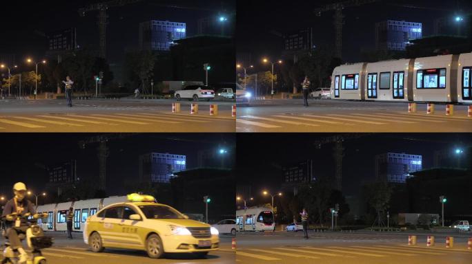 武汉光谷有轨电车L2线路过十字路口夜景