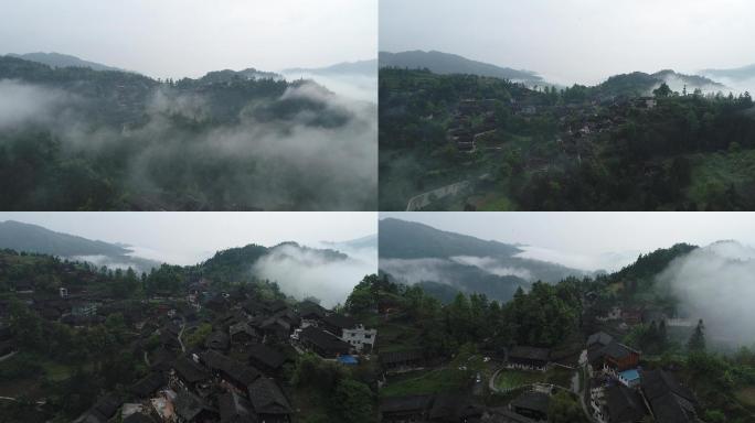 航拍晨雾大山阳光下村落中国传统村落