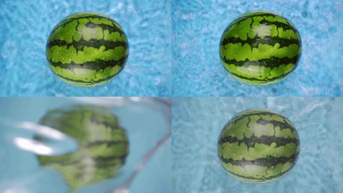 西瓜水花泼水蓝背景创意水果视频实拍