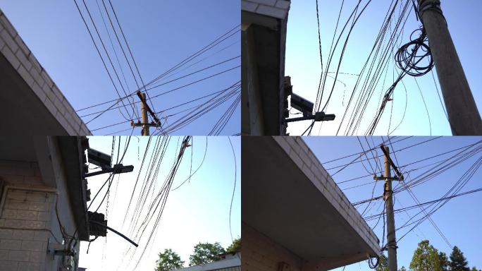 农村杂乱的电线杆与用电安全隐患