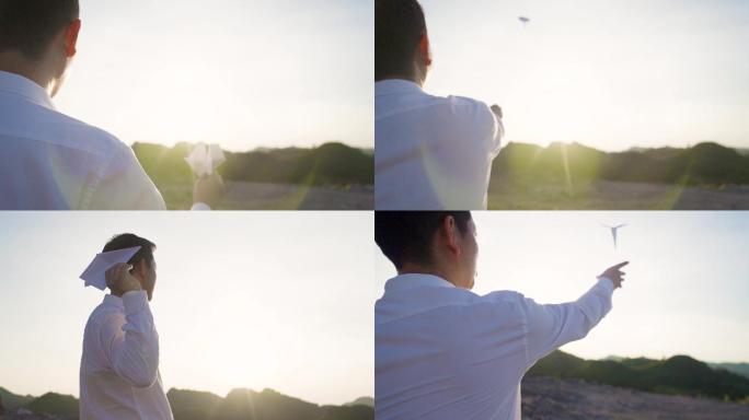 男人山顶扔纸飞机追逐梦想放飞希望概念视频
