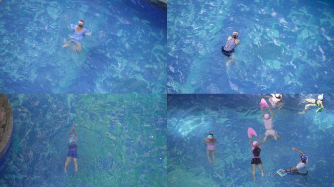 夏天小孩和青少年在蓝色的游泳池游泳