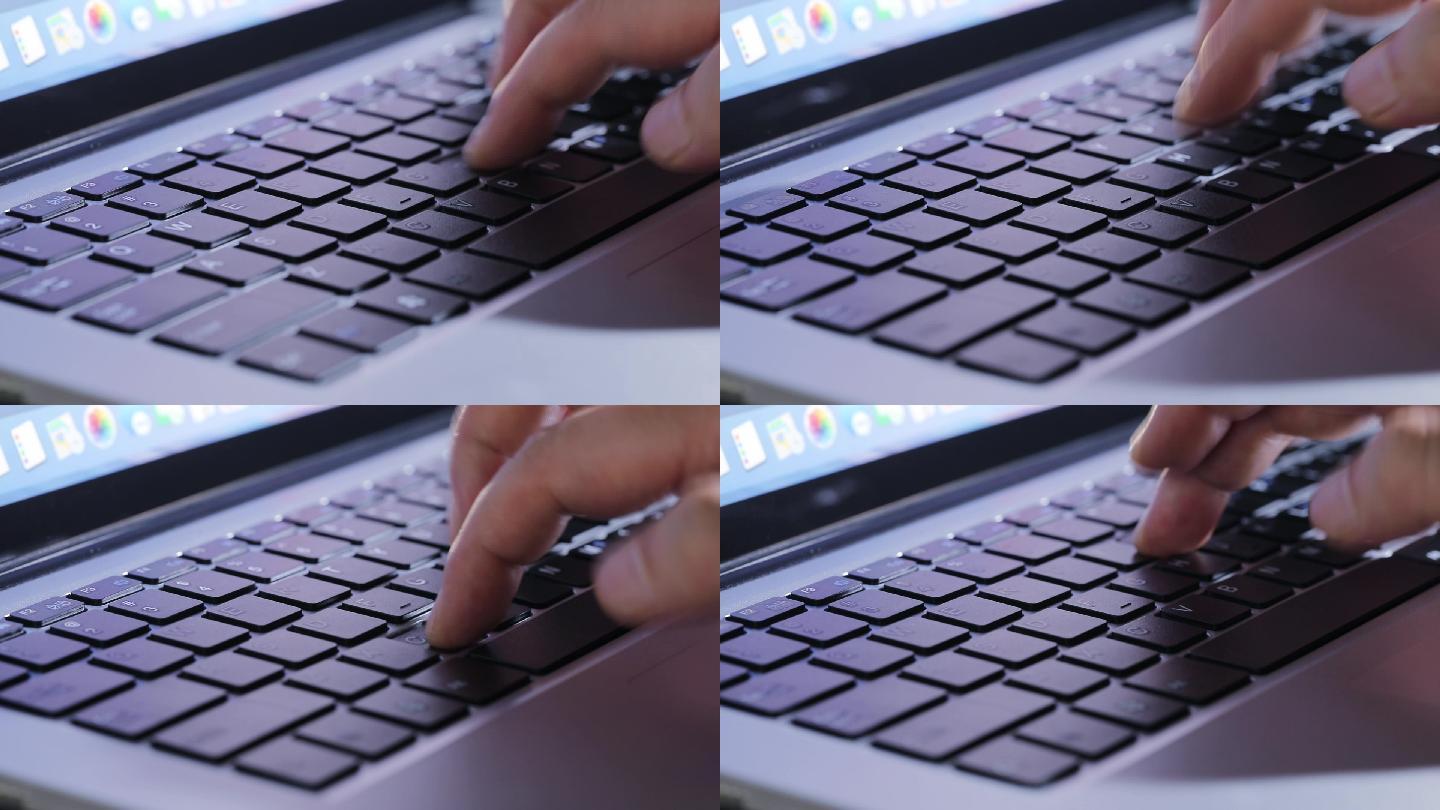 单手在笔记本电脑上敲击键盘