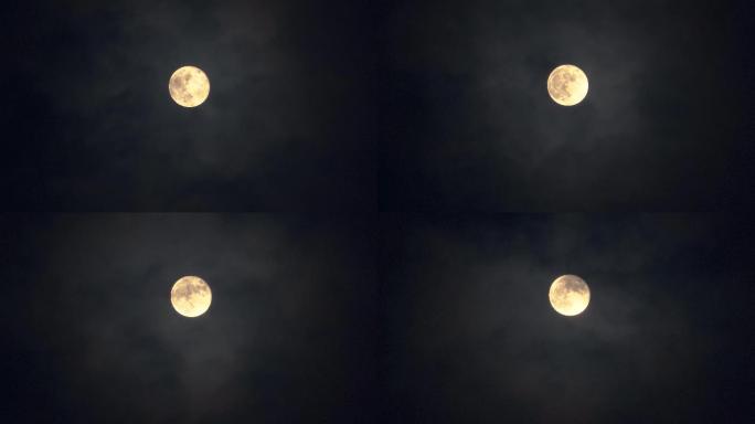 夜空中流云飘过一轮满月