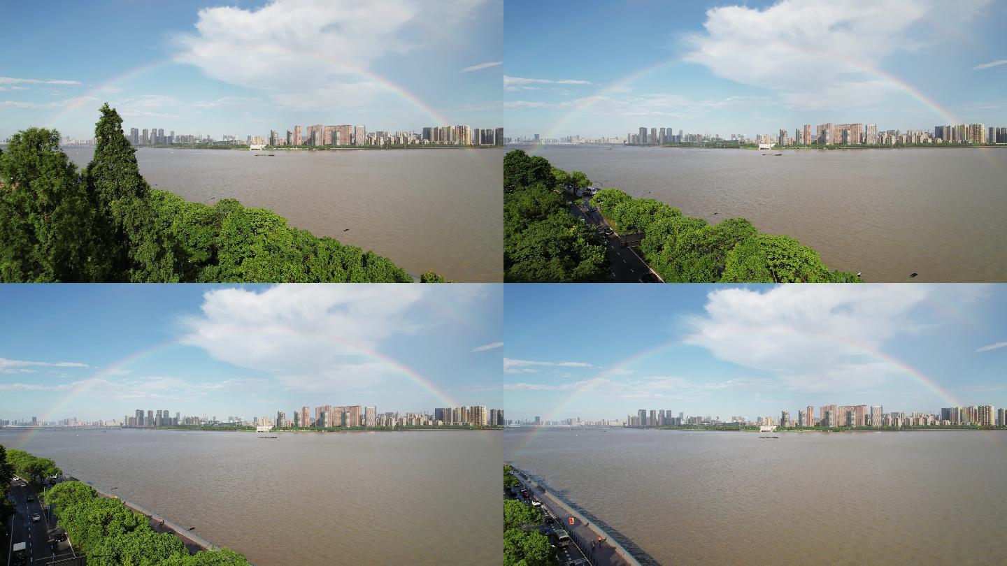 航拍雨后杭州城市上空的彩虹