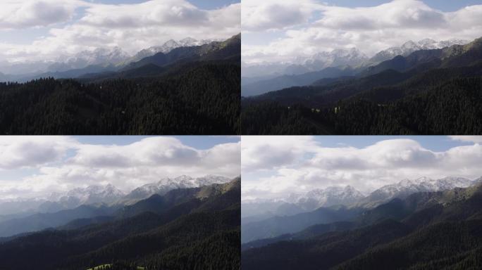 飞跃原始森林眺望雪山电影感开场 4K航拍