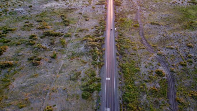 航拍行驶在笔直公路上的货车