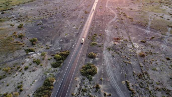 航拍行驶在笔直公路上的货车