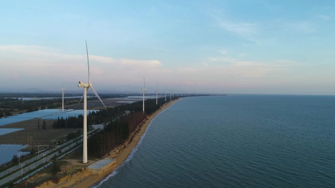 海边风车风电新能源海浪夕阳海岸线