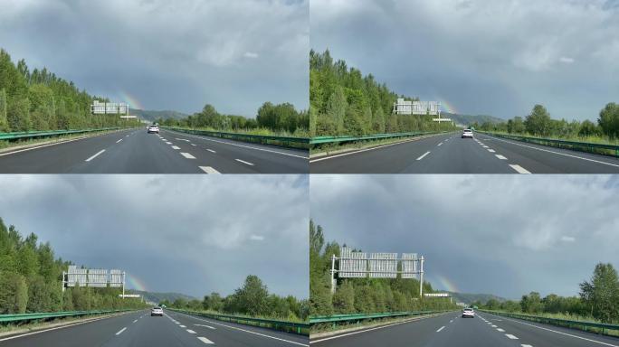 公路穿梭行驶彩虹雨过天晴自驾游