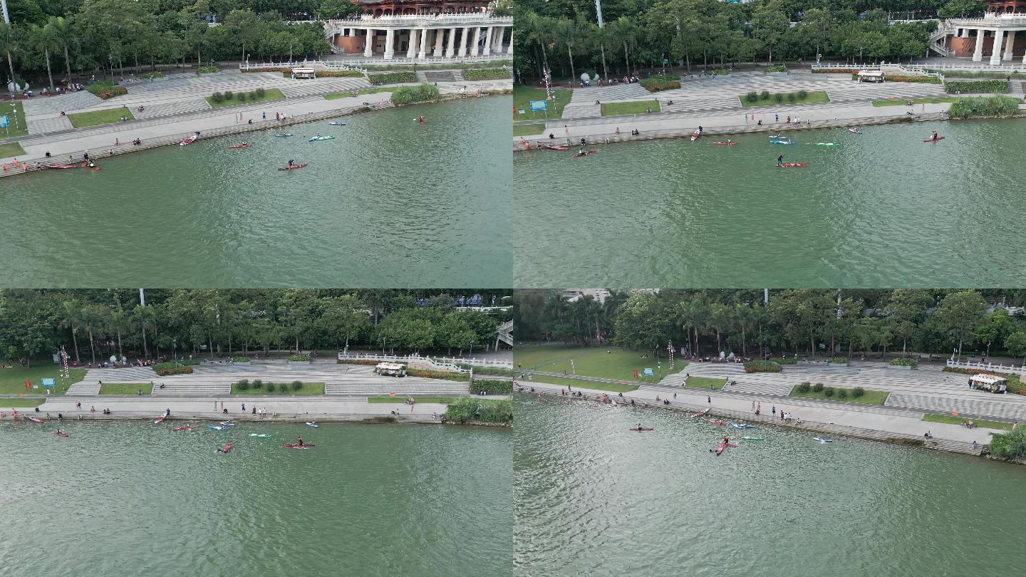广西南宁邕江边玩桨板休闲的人群风光航拍
