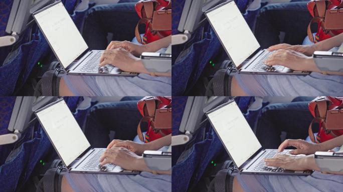 4K正版-飞机上用笔记本电脑办公的旅客