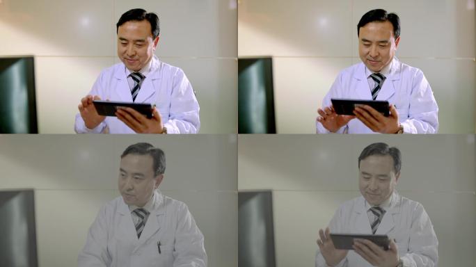 医生使用平板电脑查看电子病历
