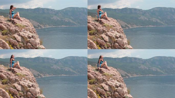 乌克兰克里米亚悬崖边上坐着的女人